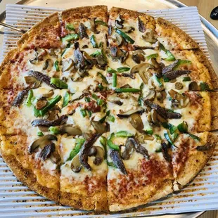 Anchovies, Mushrooms, and Green Peppers on a Thin Crust