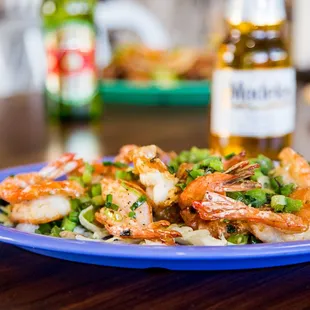 a plate of shrimp and vegetables