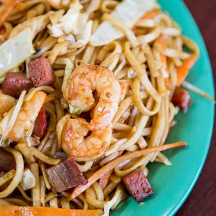 a plate of shrimp and noodles