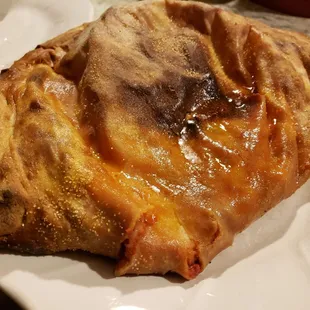 a piece of pizza on a plate
