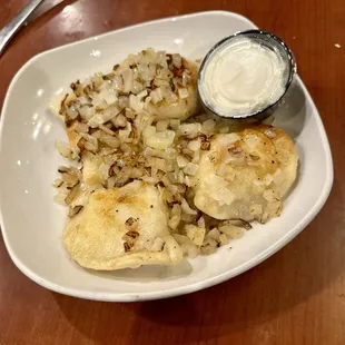 Cheese pierogis with grilled onions