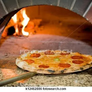 a pizza being cooked in a brick oven