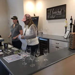 two women tasting wine in a tasting room
