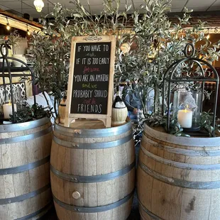 three barrels with plants in them