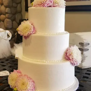 Buttercream cake and fresh flowers.
