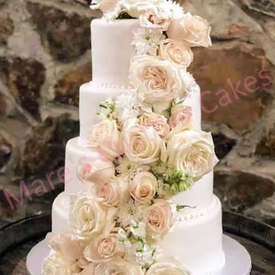 4 Tier wedding cake.  Can be buttercream or fondant covered. Serves 130