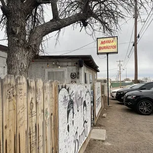 a fence with graffiti on it
