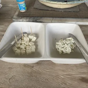 two bowls of food on a table