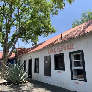 a white building with a red roof