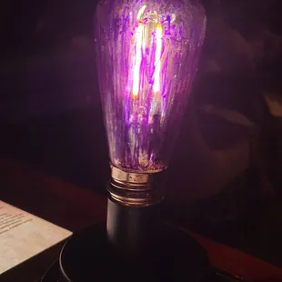 Twist the light bulb to get the attention of your waiter