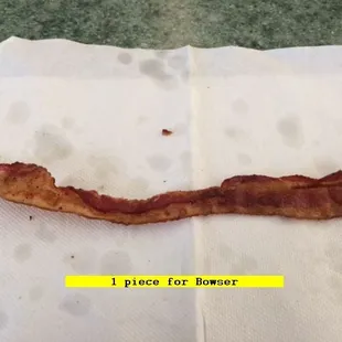 a piece of bacon on a napkin