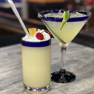 two cocktails on a table