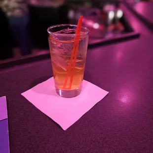 a drink in a glass with a straw