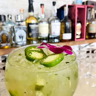 a hand holding a margarita