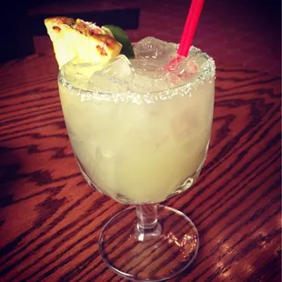 Lime margarita with pineapple wedge