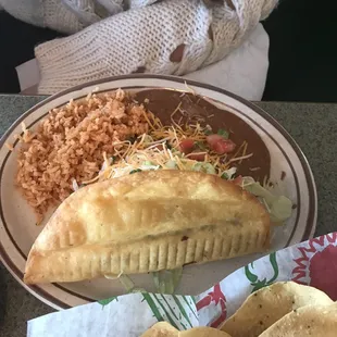 Lunch 8" taco, beef, with rice. Paid extra for beans.