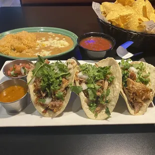Three Taco Carnitas, Refried Beans and Rice