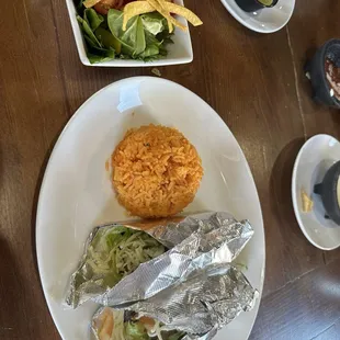 Two chicken tacos with rice and house salad