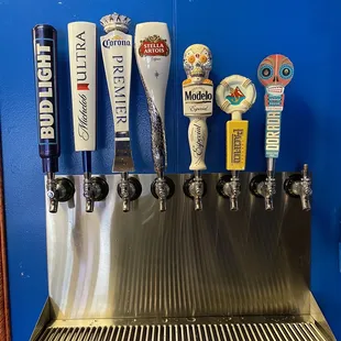 a row of beer taps