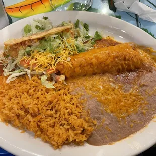 Chicken taco, chicken enchiladas, rice and beans