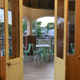 a patio with a table and chairs