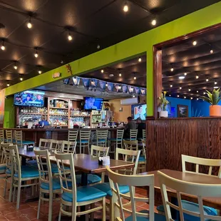 Dining room with bar in background