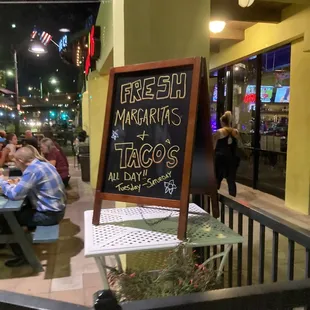 a sign for margaritas tacos