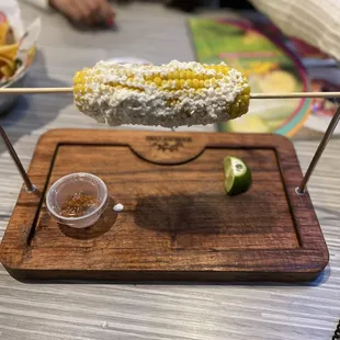a person sitting at a table with a plate of food