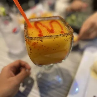 a person holding a drink