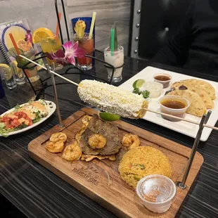 Steak Special with rice and salad, Quesabirria, and Mojito sampler (back)