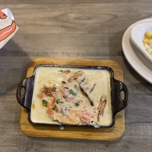 a dish of seafood and rice