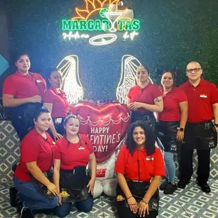 a group of employees posing for a picture