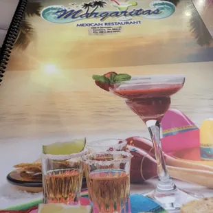a book with a picture of a drink and a plate of food