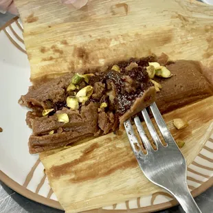 yummy delicious Chocolate tamal.  Topped off with roasted pistachios. The most delicious thing I've ever had!