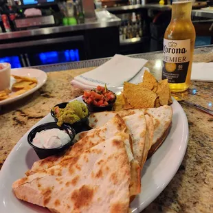 a plate of quesadillas and chips