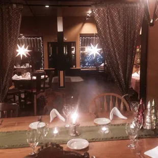 The inside of the restaurant, lit up at night.