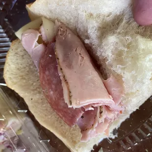 Italian cold cut with everything which apparently is a couple slices of meat a slice of cheese and chopped onion.