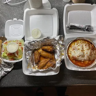 Lasagna, five piece mild wings, side salad and Garlic rolls.