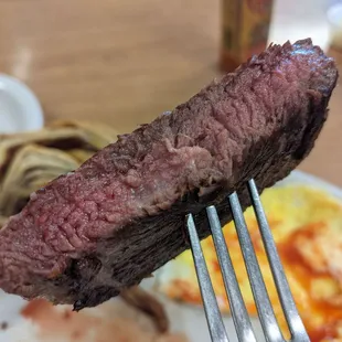 a steak on a fork
