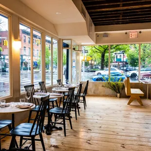 a view of a restaurant with tables and chairs