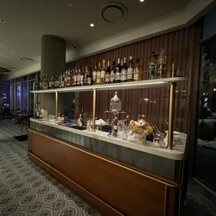 a view of a bar with bottles of liquor