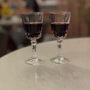 two glasses of wine on a table