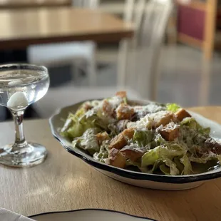 a plate of salad and a glass of water