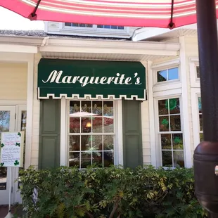Outside on terrace dining under patio table
