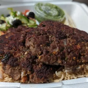a meal in a styrofoam container