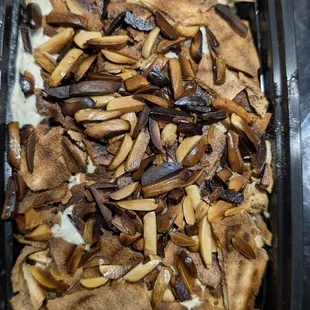 Tasekyeh with chicken - chicken, lemon, garbanzos, yogurt tahini topped with toasted pita & almonds