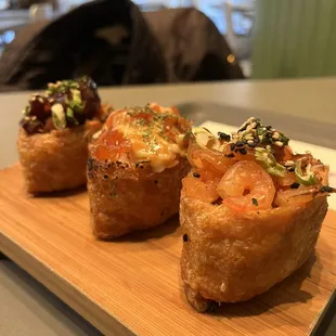 Spicy Octopus Inari, Salmon Tataki Inari, and Garlic Shrimp Inari