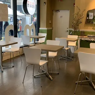 empty tables and chairs in a restaurant