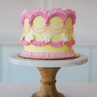 a pink and yellow cake
