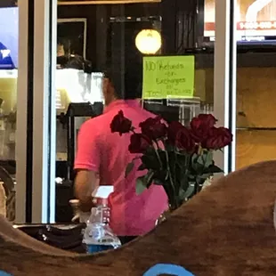 a man in a pink shirt